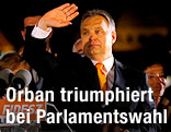 Ungarns Premierminister Viktor Orban winkt seinen Unterstützern zu