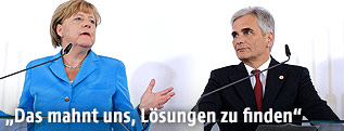 Die deutsche Bundeskanzlerin Angela Merkel und Österreichs Bundeskanzler Werner Faymann